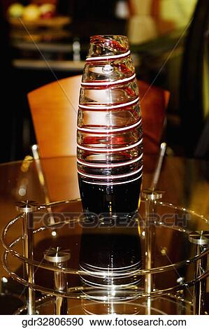 Vase on a dining table View Large Photo Image Stock Image - Vase on a dining table. Fotosearch
