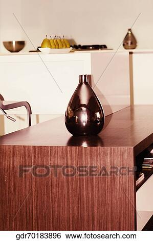 Vase on a sideboard in the kitchen View Large Photo Image Stock Photograph - Vase on a sideboard in the kitchen. Fotosearch