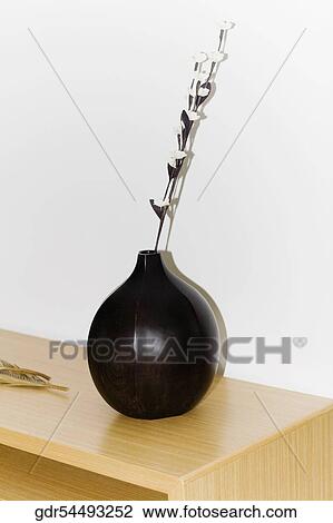 Vase on a sideboard View Large Photo Image Stock Image - Vase on a sideboard. Fotosearch