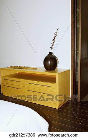 Stock Photograph - Vase on a sideboard. Fotosearch