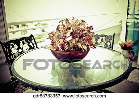 Vase on a table in a living room View Large Photo Image Stock Photo - Vase on a table in a living room. Fotosearch