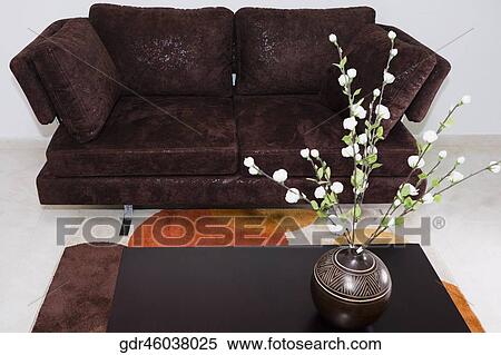 Vase on a table in a living room View Large Photo Image Stock Photography - Vase on a table in a living room. Fotosearch