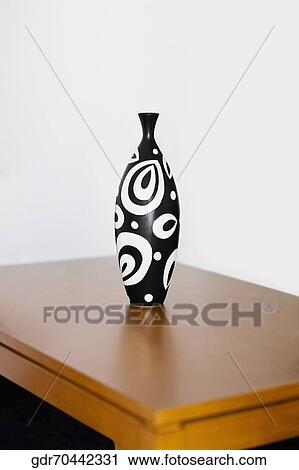 Vase on a table View Large Photo Image Stock Image - Vase on a table. Fotosearch