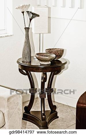Vase with bowls on a stool View Large Photo Image Stock Photo - Vase with bowls on a stool. Fotosearch