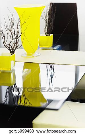 Vase with showpieces on a table View Large Photo Image Stock Image - Vase with showpieces on a table. Fotosearch
