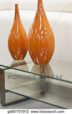 Vases on a glass table View Large Photo Image Stock Image - Vases on a glass table. Fotosearch