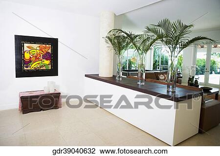Stock Image - Vases on a ledge in a living room. Fotosearch