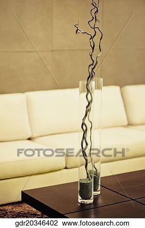 Vases on a table in front of a couch View Large Photo Image Stock Image - Vases on a table in front of a couch. Fotosearch