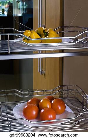 Vegetables on shelves in the kitchen View Large Photo Image Picture - Vegetables on shelves in the kitchen. Fotosearch