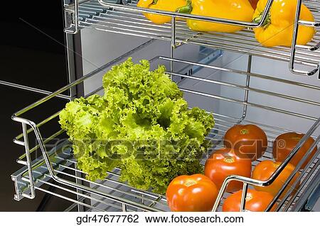 Vegetables on shelves in the kitchen View Large Photo Image Stock Image - Vegetables on shelves in the kitchen. Fotosearch