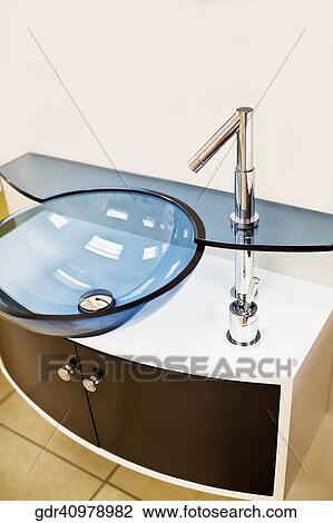 Wash bowl on a cabinet in the bathroom View Large Photo Image Stock Image - Wash bowl on a cabinet in the bathroom. Fotosearch