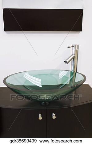 Wash bowl on a cabinet in the bathroom View Large Photo Image Stock Photo - Wash bowl on a cabinet in the bathroom. Fotosearch