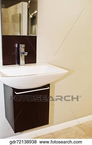 Wash bowl on a cabinet in the bathroom View Large Photo Image Stock Photo - Wash bowl on a cabinet in the bathroom. Fotosearch