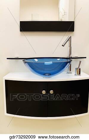 Wash bowl on a cabinet in the bathroom View Large Photo Image Stock Photo - Wash bowl on a cabinet in the bathroom. Fotosearch
