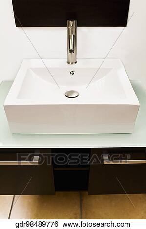 Wash bowl over a cabinet View Large Photo Image Stock Photograph - Wash bowl over a cabinet. Fotosearch