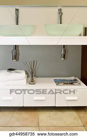 Wash bowls on a cabinet in the bathroom View Large Photo Image Stock Photography - Wash bowls on a cabinet in the bathroom. Fotosearch