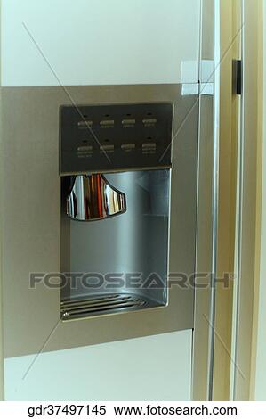 Stock Photography - Water dispenser of a refrigerator. Fotosearch