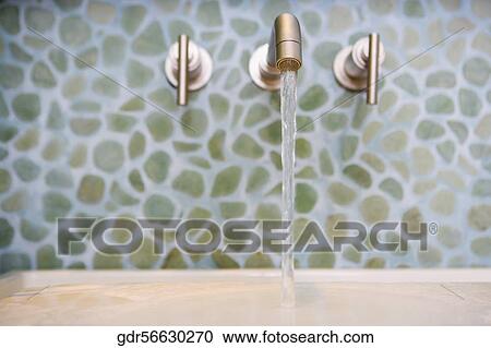 Water running from a faucet View Large Photo Image Stock Image - Water running from a faucet. Fotosearch