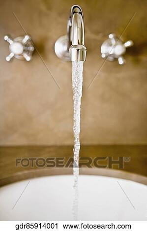 Water running from a faucet View Large Photo Image Stock Image - Water running from a faucet. Fotosearch