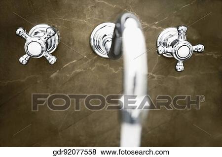 Water running from a faucet View Large Photo Image Stock Photo - Water running from a faucet. Fotosearch