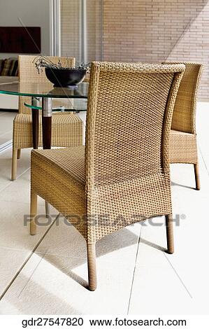 Wicker chairs with a table View Large Photo Image Stock Image - Wicker chairs with a table. Fotosearch
