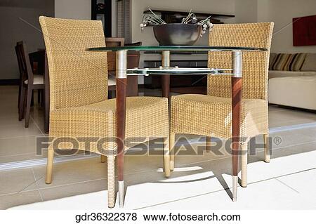 Wicker chairs with a table View Large Photo Image Stock Photo - Wicker chairs with a table. Fotosearch
