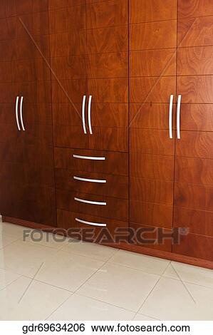 Stock Photograph - Wooden cupboards in a room. Fotosearch