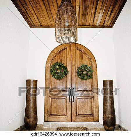 Wreaths hanging on door View Large Photo Image Picture - Wreaths hanging on door. Fotosearch