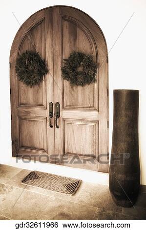 Stock Photograph - Wreaths hanging on the door. Fotosearch