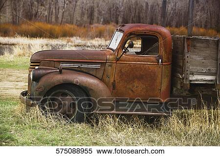 Abandoned truck in a field, Ghost Town, Virginia City, Montana, USA View Large Photo Image Stock Photography - Abandoned truck in a field, Ghost Town, Virginia City, Montana, USA. Fotosearch