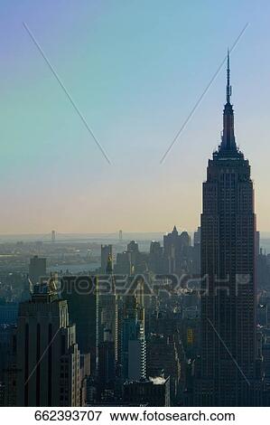 Stock Photo - Aerial view of skyscrapers in a city, Empire State Building, Manhattan, New York City, New York State, USA. Fotosearch