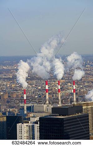 Aerial view of smoke emerging from smoke stacks of a factory, Manhattan, New York City, New York State, USA View Large Photo Image Picture - Aerial view of smoke emerging from smoke stacks of a factory, Manhattan, New York City, New York State, USA. Fotosearch