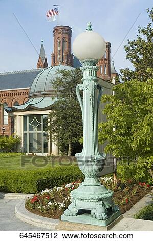 Stock Image - American flag fluttering on a government building, Potomac River, Washington DC, USA. Fotosearch