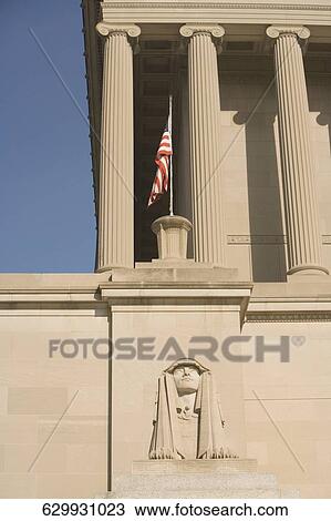 Stock Image - American flag on a building, Masonic Temple, 16St. NW, Washington DC, USA. Fotosearch