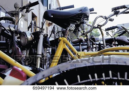 Bicycles in a parking lot View Large Photo Image Picture - Bicycles in a parking lot. Fotosearch