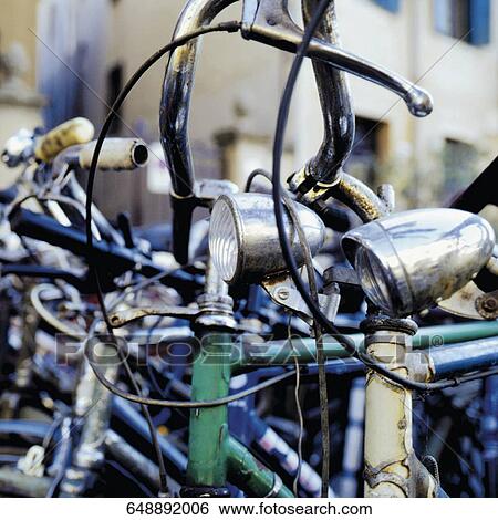 Stock Photograph - Bicycles in a parking lot. Fotosearch