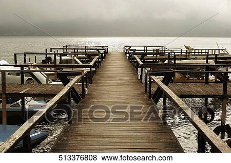 Boats docked at a pier, Singapore View Large Photo Image Stock Photo - Boats docked at a pier, Singapore. Fotosearch