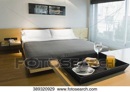Breakfast tray on a table in a hotel room View Large Photo Image Stock Photo - Breakfast tray on a table in a hotel room. Fotosearch