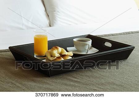 Breakfast tray on the bed View Large Photo Image Stock Photo - Breakfast tray on the bed. Fotosearch