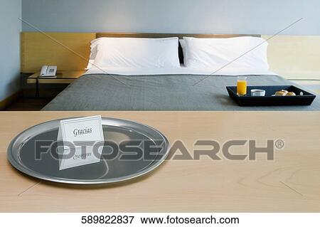 Stock Photo - Breakfast tray on the bed. Fotosearch