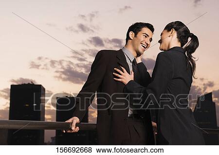 Businessman and a businesswoman smiling face to face View Large Photo Image Stock Photo - Businessman and a businesswoman smiling face to face. Fotosearch
