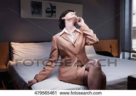Stock Image - Businesswoman talking on a mobile phone. Fotosearch