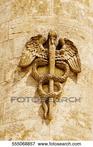 Stock Photo - Caduceus symbol carved on a column, Rostrale Columns, Place des Quinconces, Bordeaux, France. Fotosearch