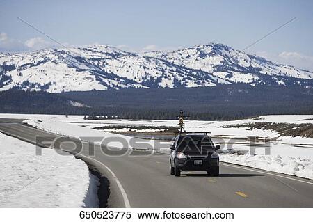 Car on the road, Grand Teton National Park, Wyoming, USA View Large Photo Image Stock Photography - Car on the road, Grand Teton National Park, Wyoming, USA. Fotosearch