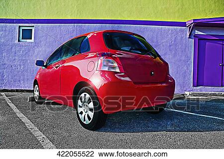 Stock Image - Car parked in front of a building. Fotosearch