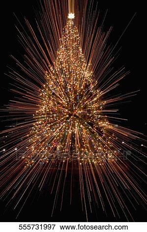 Christmas tree lit up at night View Large Photo Image Stock Photo - Christmas tree lit up at night. Fotosearch