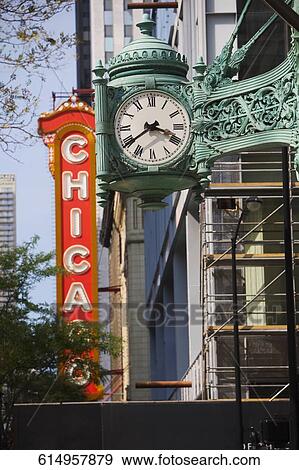 Clock in front of an entertainment building, Chicago Theater, Chicago, Illinois, USA View Large Photo Image Stock Photo - Clock in front of an entertainment building, Chicago Theater, Chicago, Illinois, USA. Fotosearch