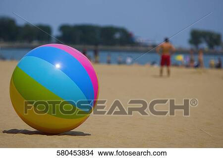Picture - Close-up of a ball on the beach, Oak Street Beach, Lake Shore Drive, Chicago, Illinois, USA. Fotosearch