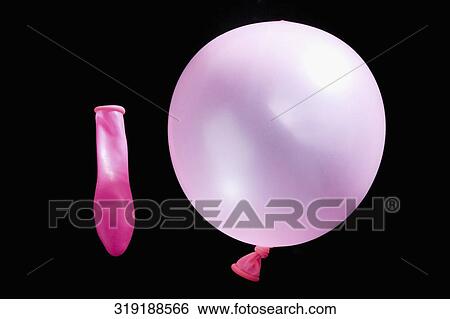 Close-up of a balloon with a deflated balloon View Large Photo Image Stock Photograph - Close-up of a balloon with a deflated balloon. Fotosearch