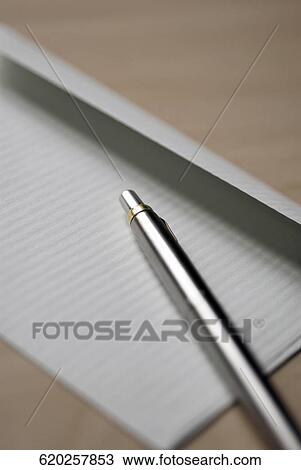 Close-up of a ballpoint pen on a sheet of paper View Large Photo Image Stock Image - Close-up of a ballpoint pen on a sheet of paper. Fotosearch